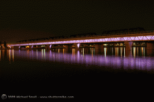 Photograph of Metro Light Rail Bridge over Tempe Town Lake at Night