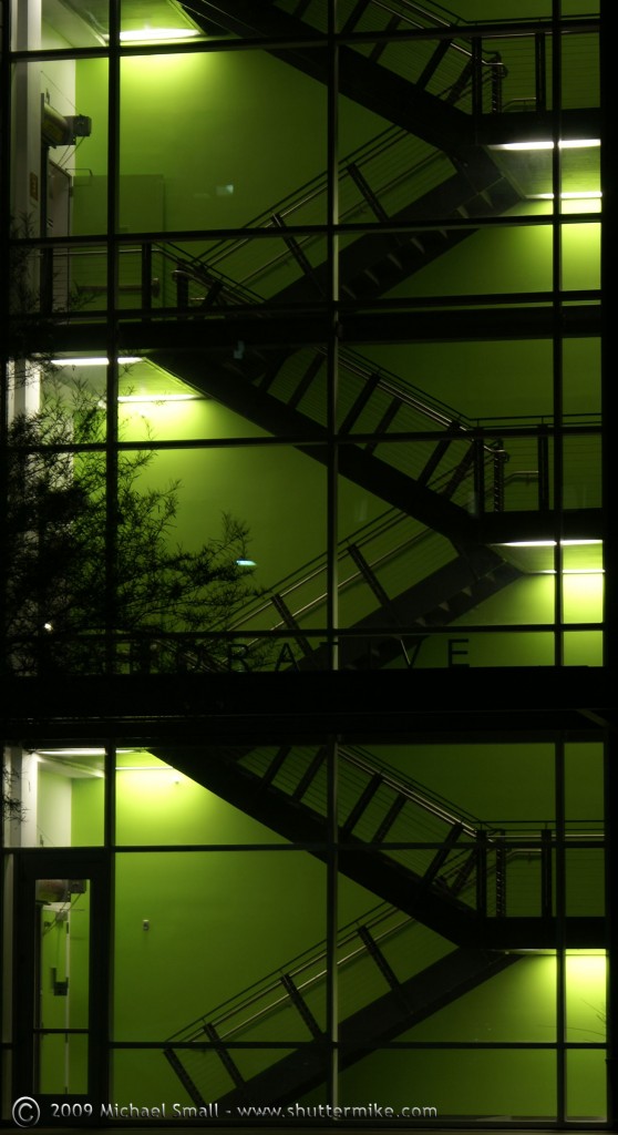 Glowing Green - Photo of a Green Lit Stairwell at Night