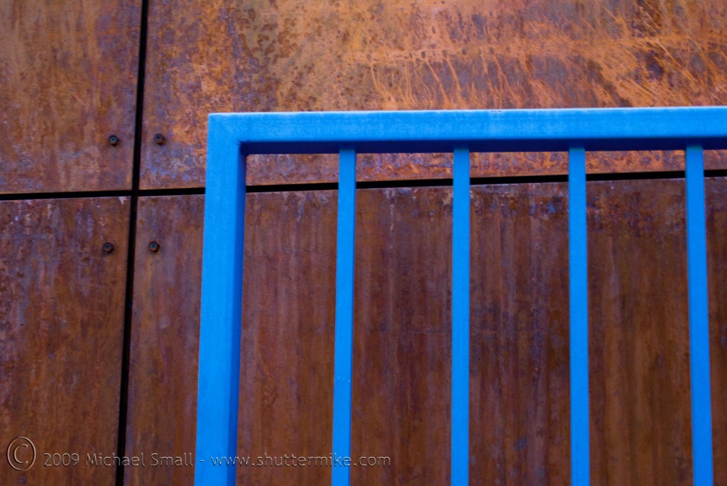 Photo of rust adn a blur iron gate