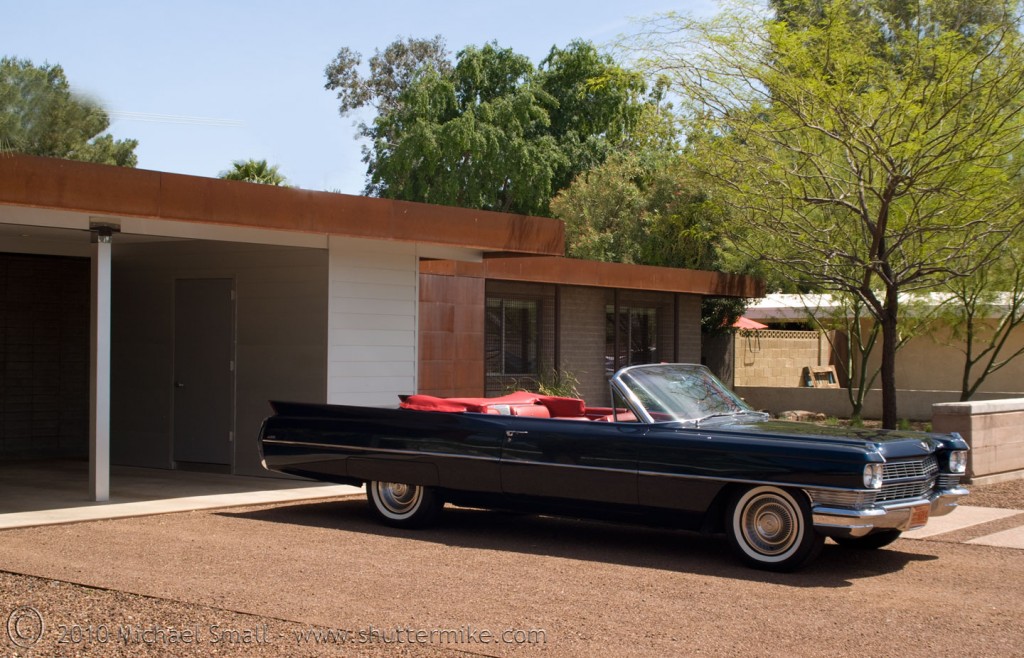 Exterior photo of a mid-century modern home in Phoenix with a classic car in the driveway.