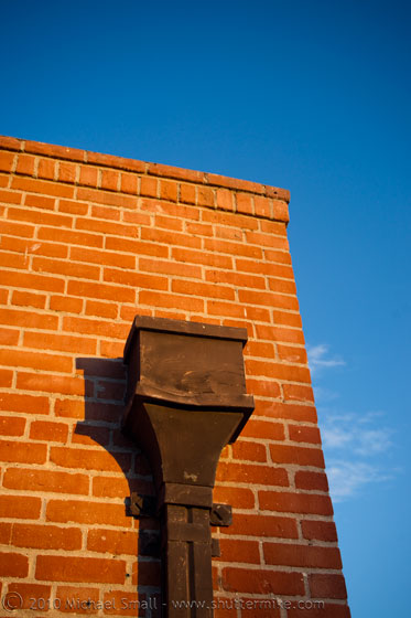 Photo of a brick building at sunset