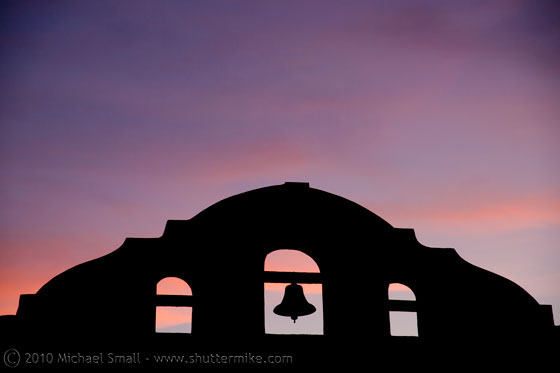 Photo of the Gilbert Historical Society silhouetted against the sunset
