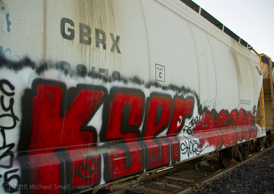 Photo of grafitti tagged train cars
