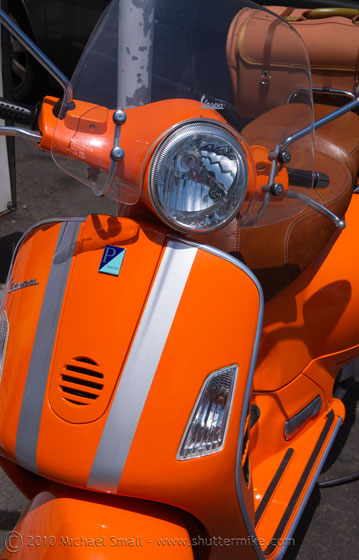 Photo of an orange Vespa scooter in San Diego