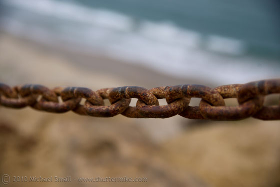 Photo of a rusting chain at the Pacific Ocean