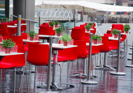 Photo of red chairs against a grey background