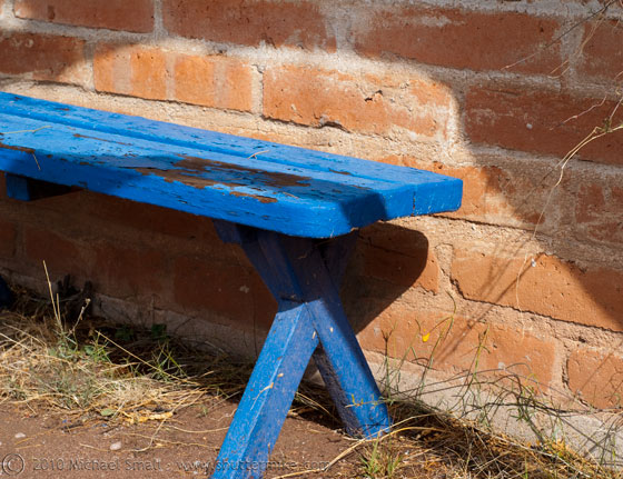 Photo of a blue wooden bench in Tubac, AZ