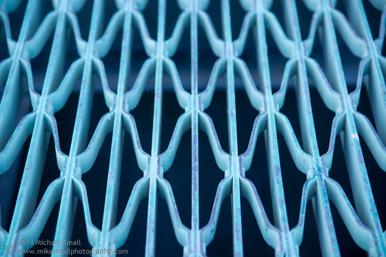 Detail photo of a blue drainage grate