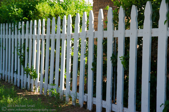 Photograph of a white picket fence
