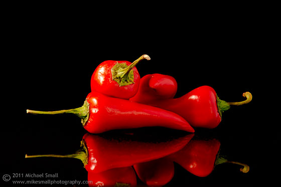 Still life food photograph of red Fresno peppers