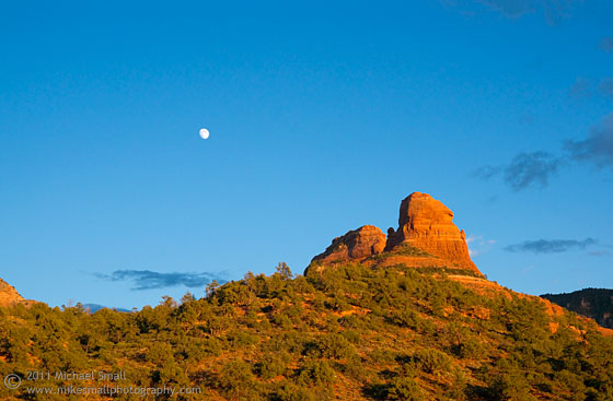 Photo of the moon rising over the red rocks of Sedona, AZ