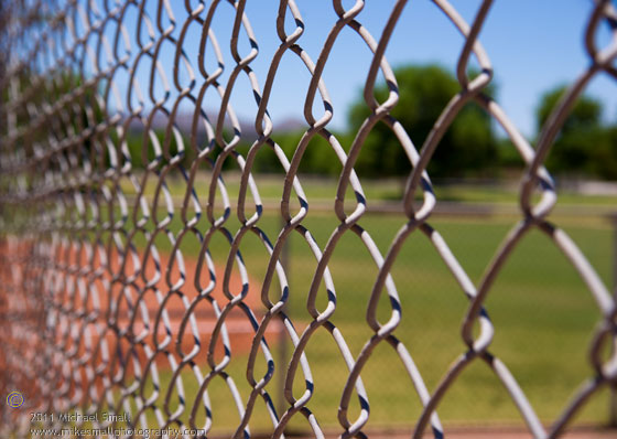 Shallow depth of field photo of a chain linked fence