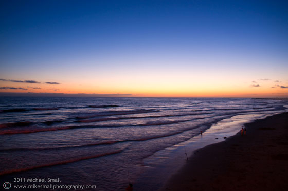 Photograph of the sun setting over the Pacific Ocean at Ocean Beach, CA