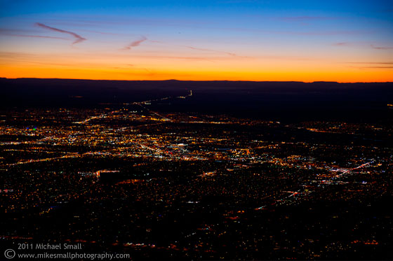 Photo of the sun setting over Albuquerque seen from Sandia Peak