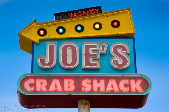 Photo of a neon Joe's Crab Shack sign