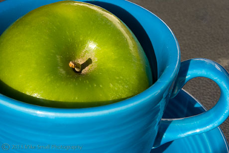 Green Apple in Blue Cup